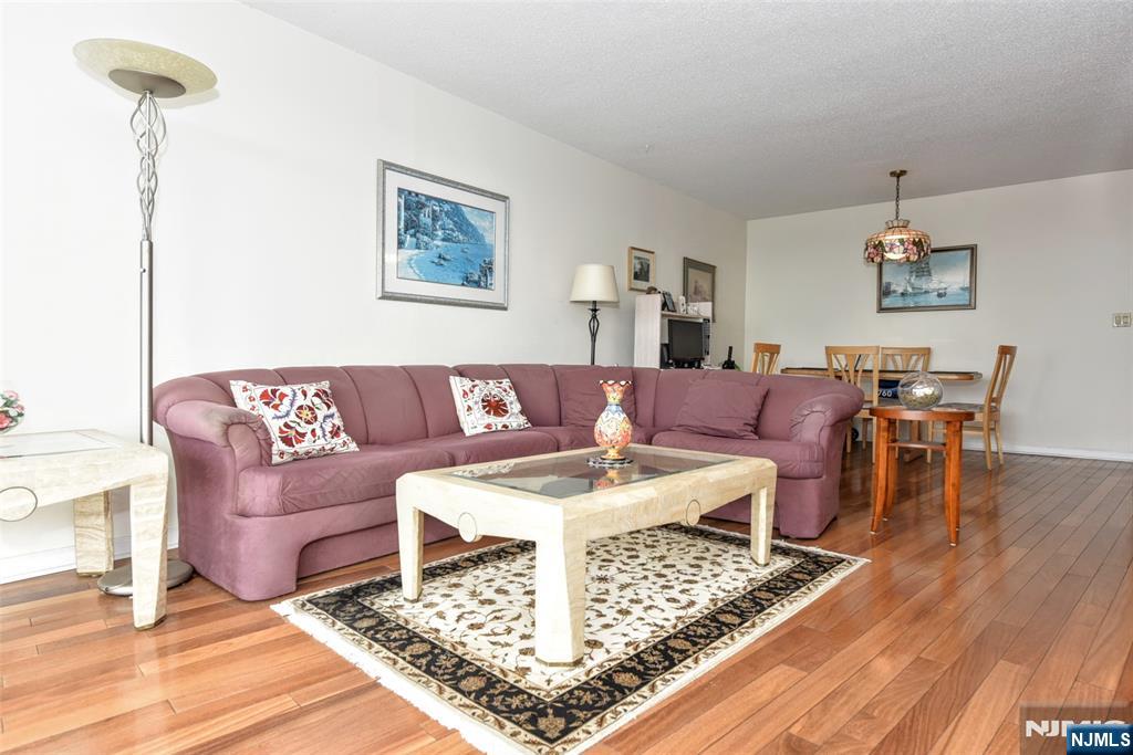 555 North, Unit 8N Fort Lee, NJ 07024 - Photo 9 of 19 a living room with furniture and a wooden floor