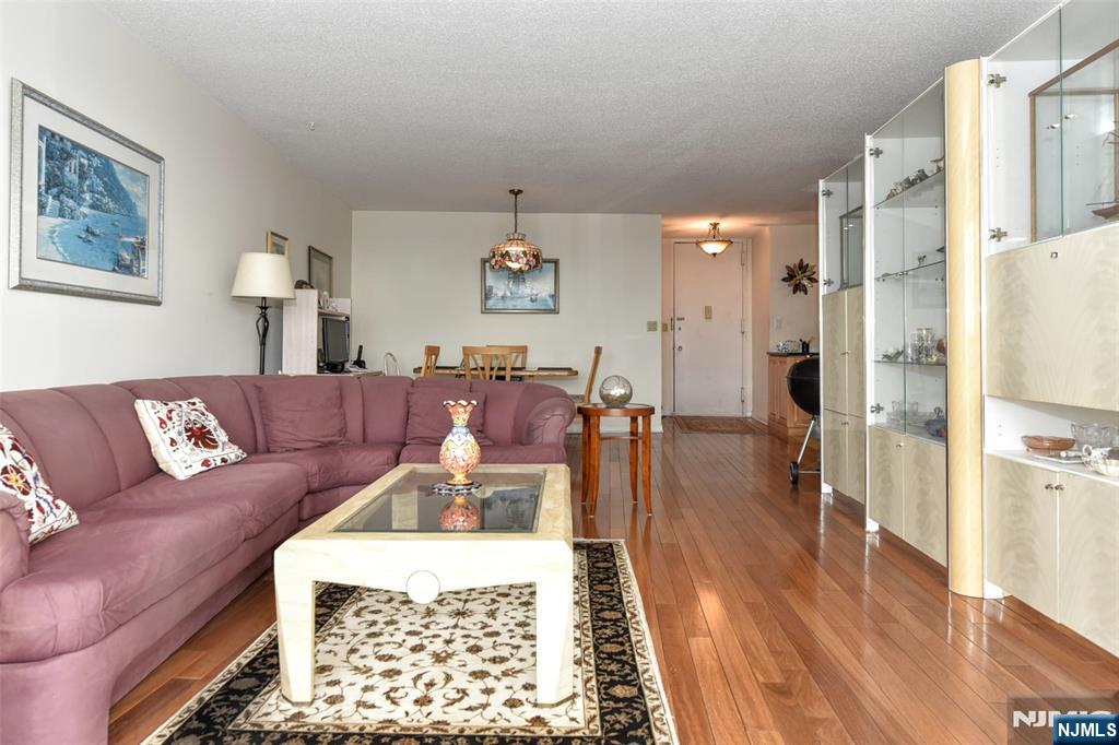 555 North, Unit 8N Fort Lee, NJ 07024 - Photo 10 of 19 a living room with furniture and a rug