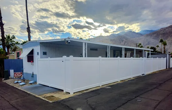 a view of house with yard