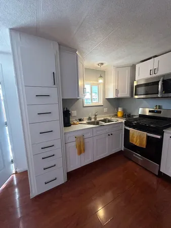 a kitchen with a sink and cabinets