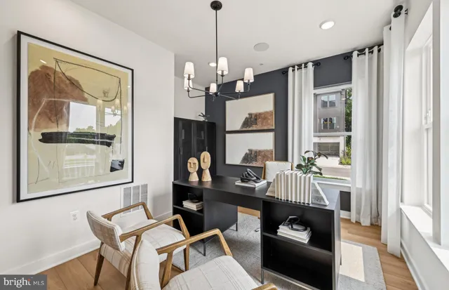 a view of a dining room with furniture wooden floor and chandelier