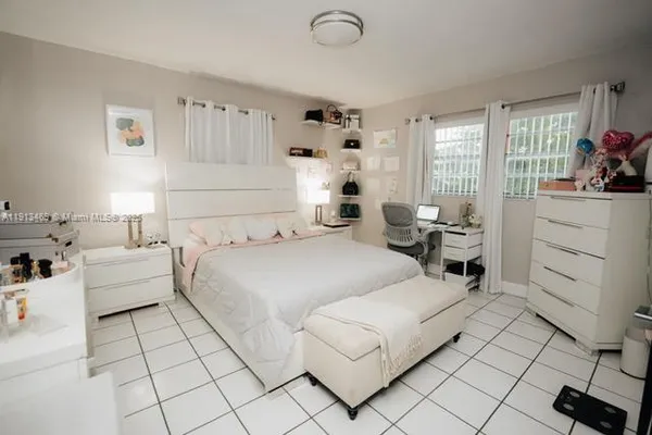 a kitchen with stainless steel appliances a stove a sink a refrigerator and cabinets