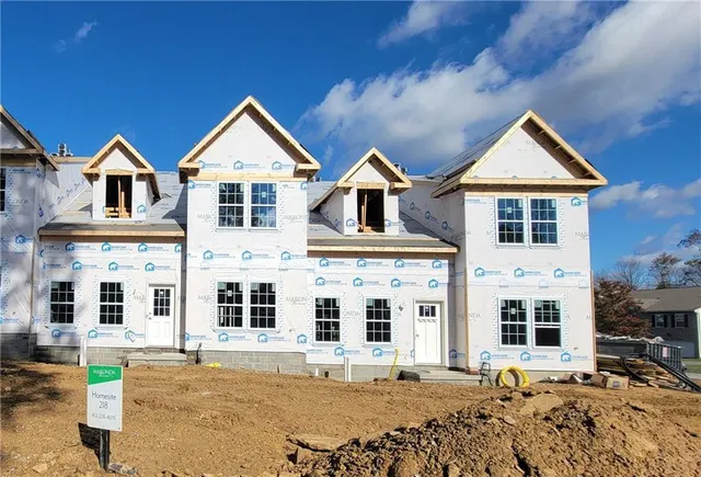 front view of a house with a yard