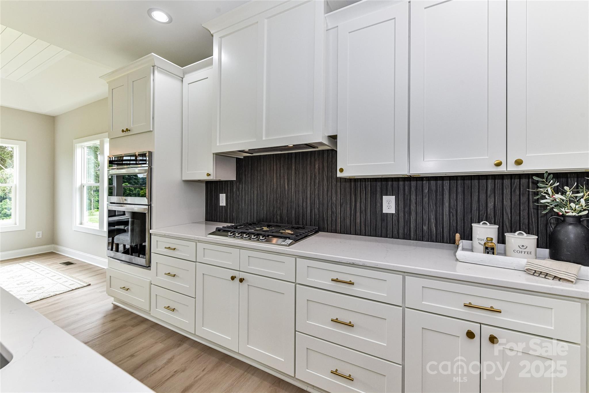 181 Lone Pine Road Statesville, NC 28625 - Photo 14 of 42 a kitchen with granite countertop white cabinets and sink