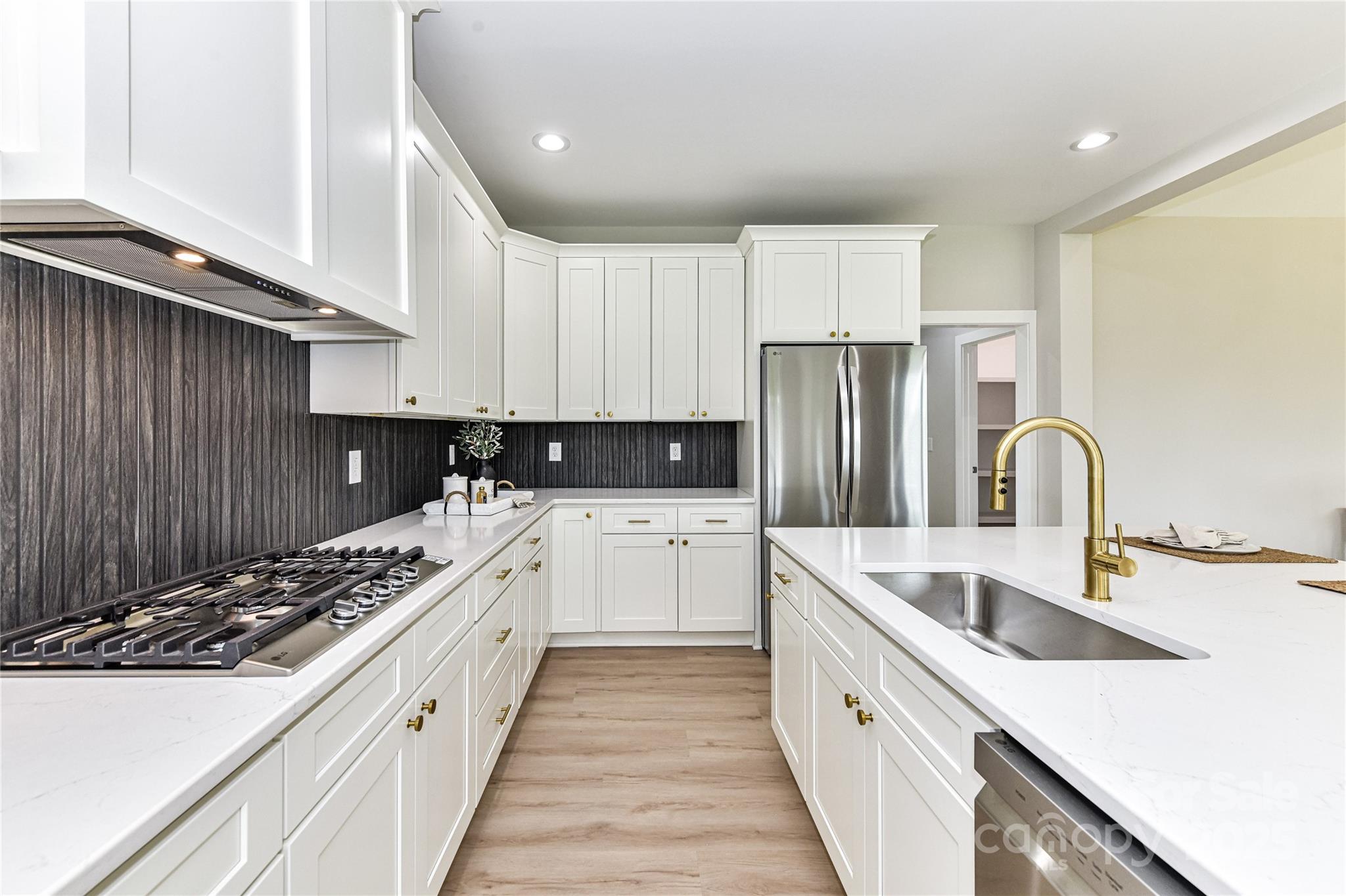 181 Lone Pine Road Statesville, NC 28625 - Photo 16 of 42 a kitchen with stainless steel appliances kitchen island granite countertop a sink and cabinets
