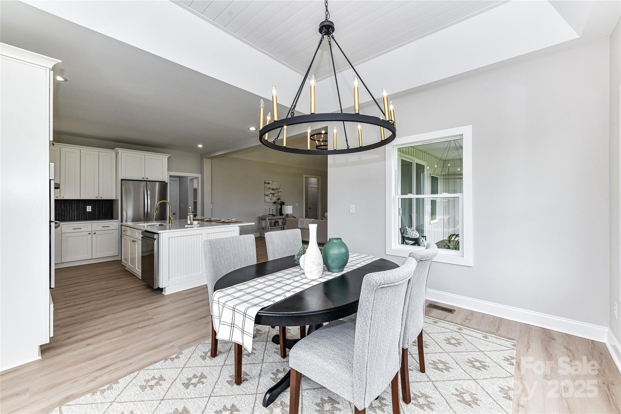 181 Lone Pine Road Statesville, NC 28625 - Photo 18 of 42 a view of a dining room with furniture window and wooden floor