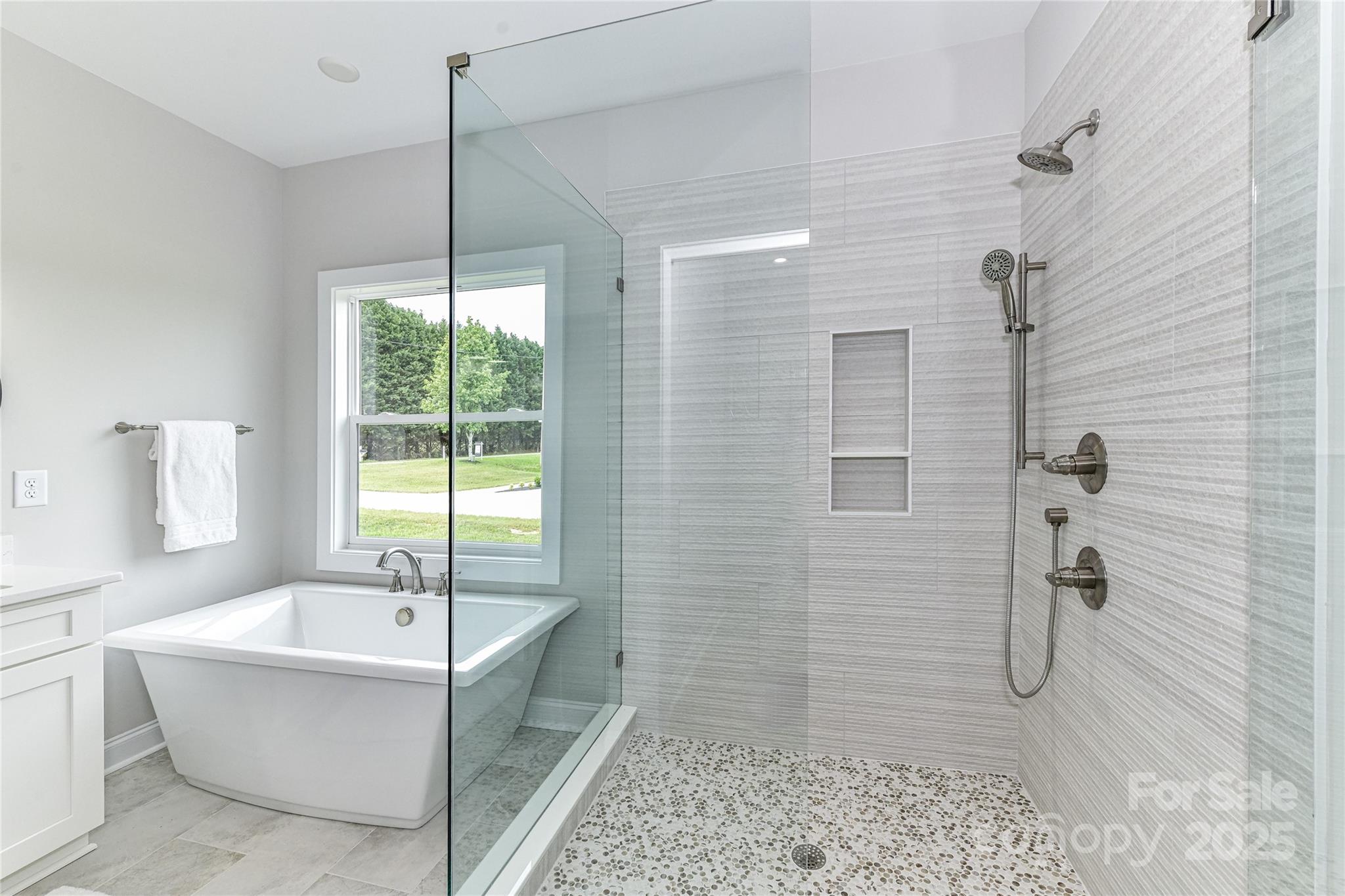 181 Lone Pine Road Statesville, NC 28625 - Photo 23 of 42 a bathroom with a bathtub and shower