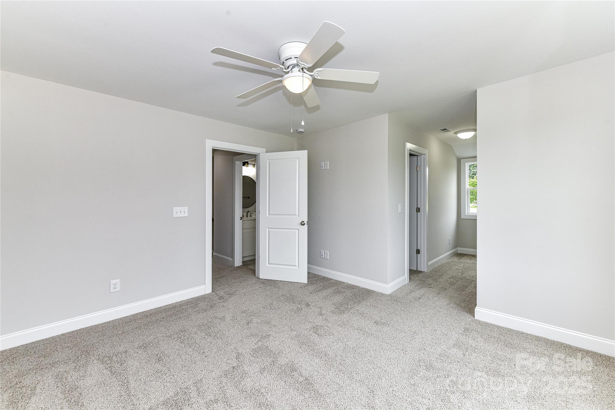 181 Lone Pine Road Statesville, NC 28625 - Photo 30 of 42 an empty room with fan and a ceiling fan