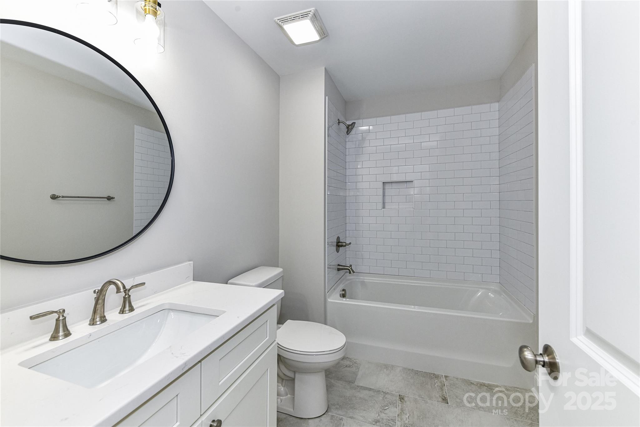 181 Lone Pine Road Statesville, NC 28625 - Photo 31 of 42 a bathroom with a sink a toilet and a mirror