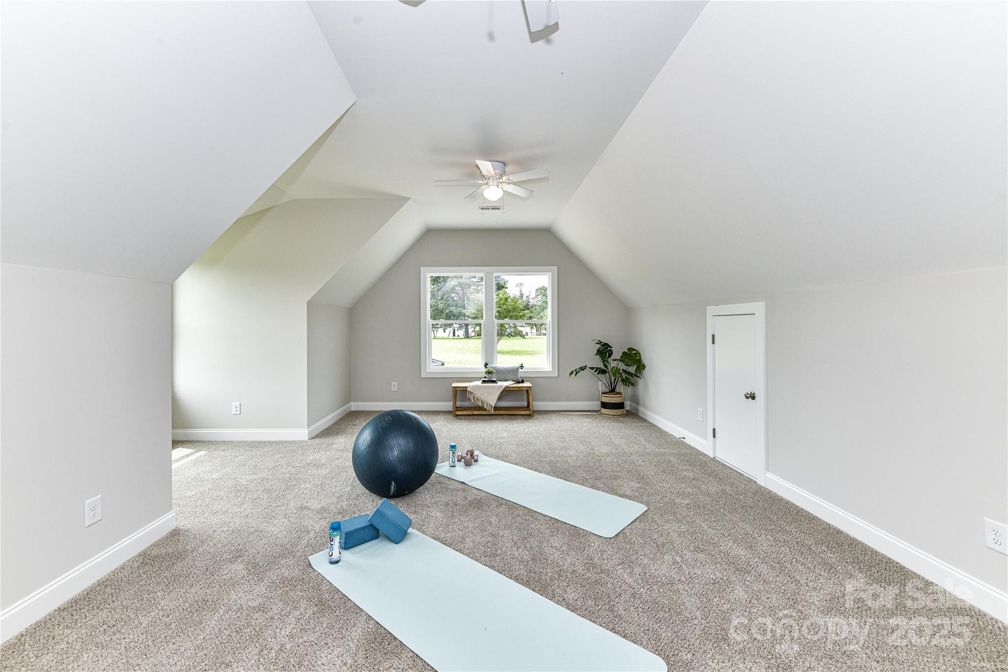 181 Lone Pine Road Statesville, NC 28625 - Photo 32 of 42 a living room with furniture a chandelier and a large window
