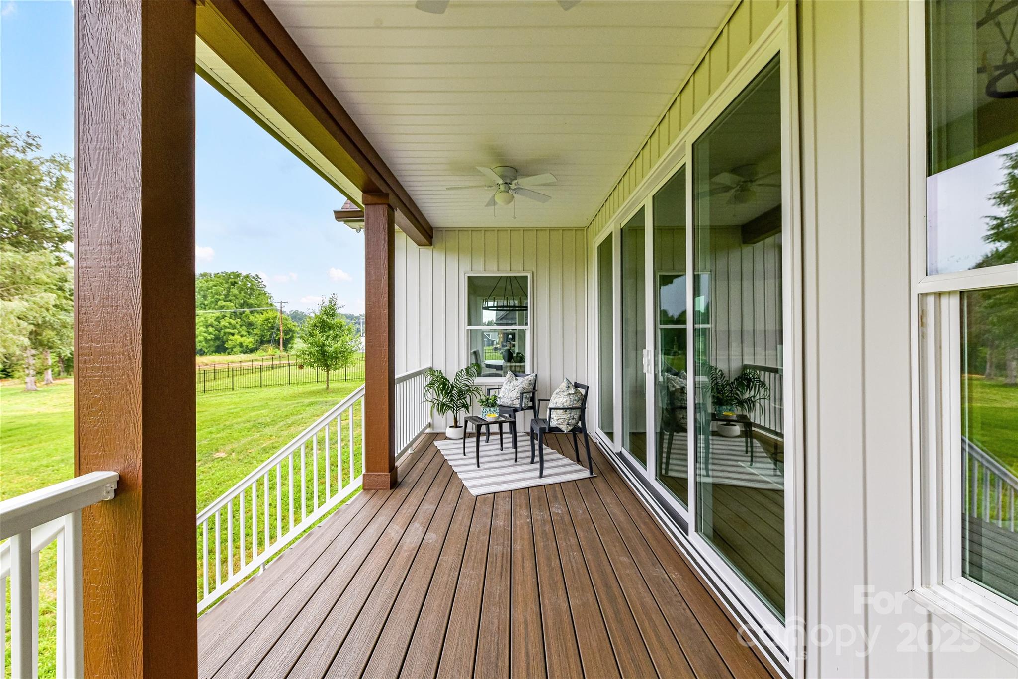 181 Lone Pine Road Statesville, NC 28625 - Photo 34 of 42 a view of a balcony with chairs and wooden floor