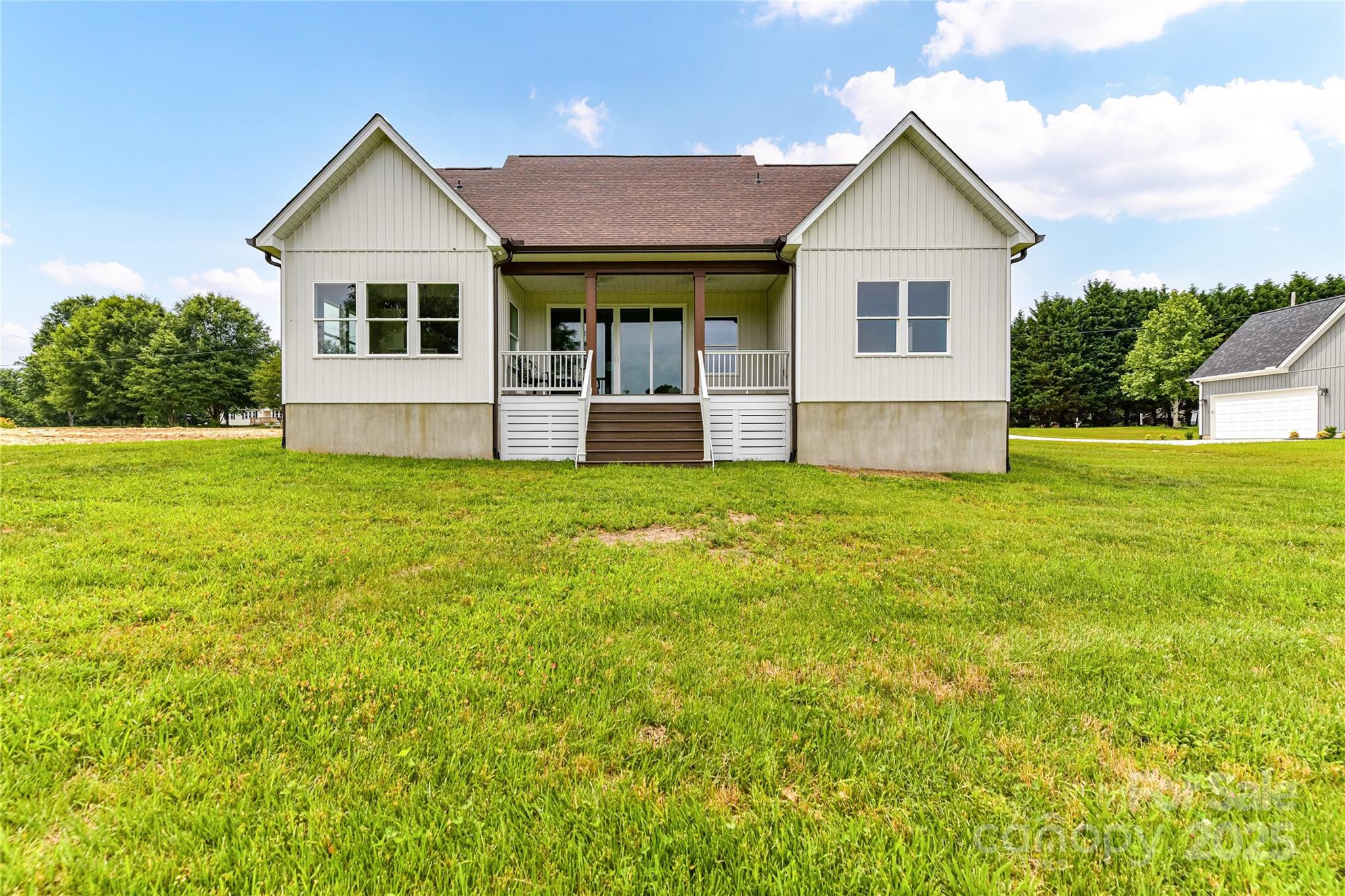 181 Lone Pine Road Statesville, NC 28625 - Photo 37 of 42 a view of a house with a yard and garage