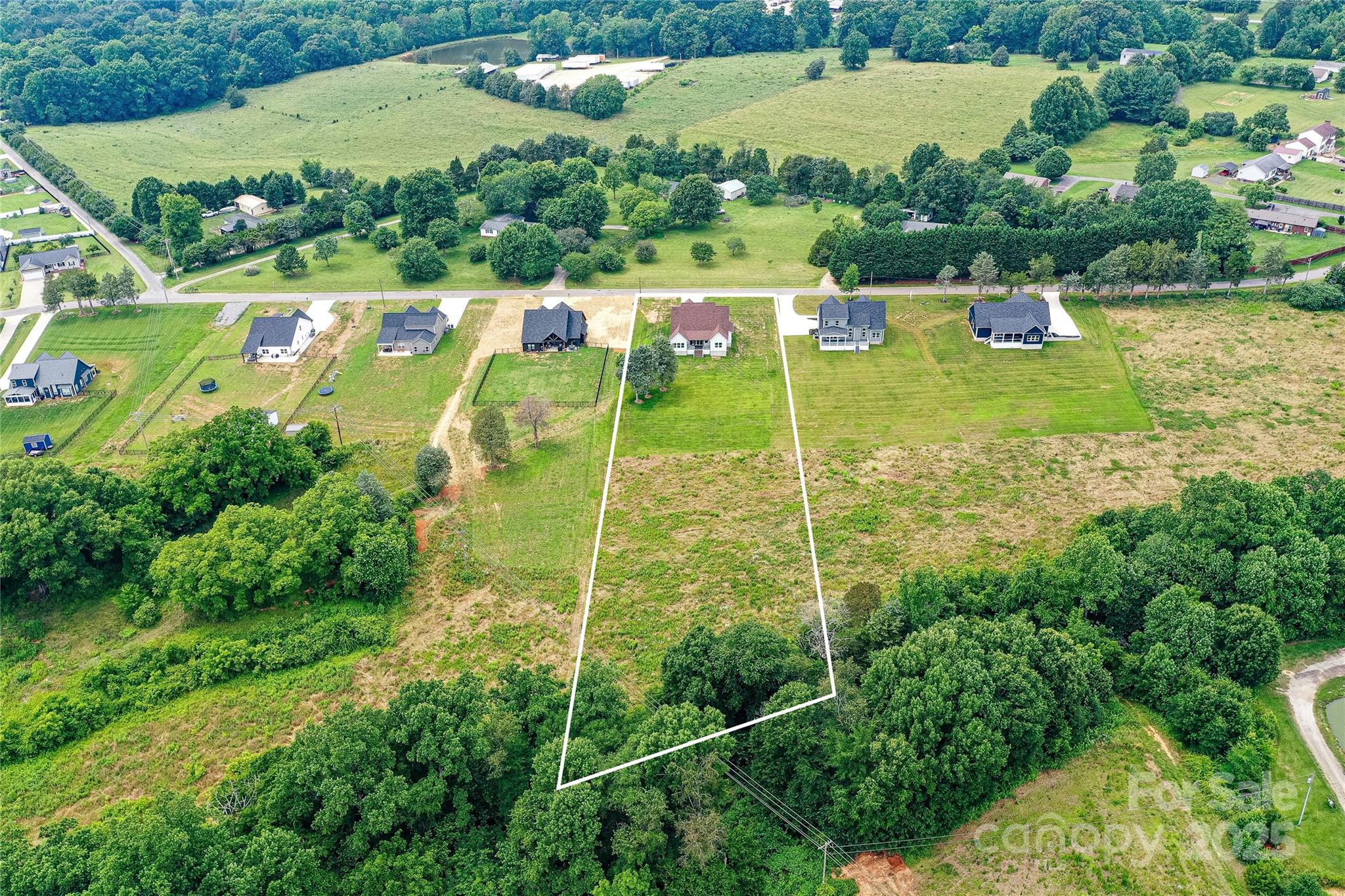 181 Lone Pine Road Statesville, NC 28625 - Photo 40 of 42 an aerial view of a houses with a yard
