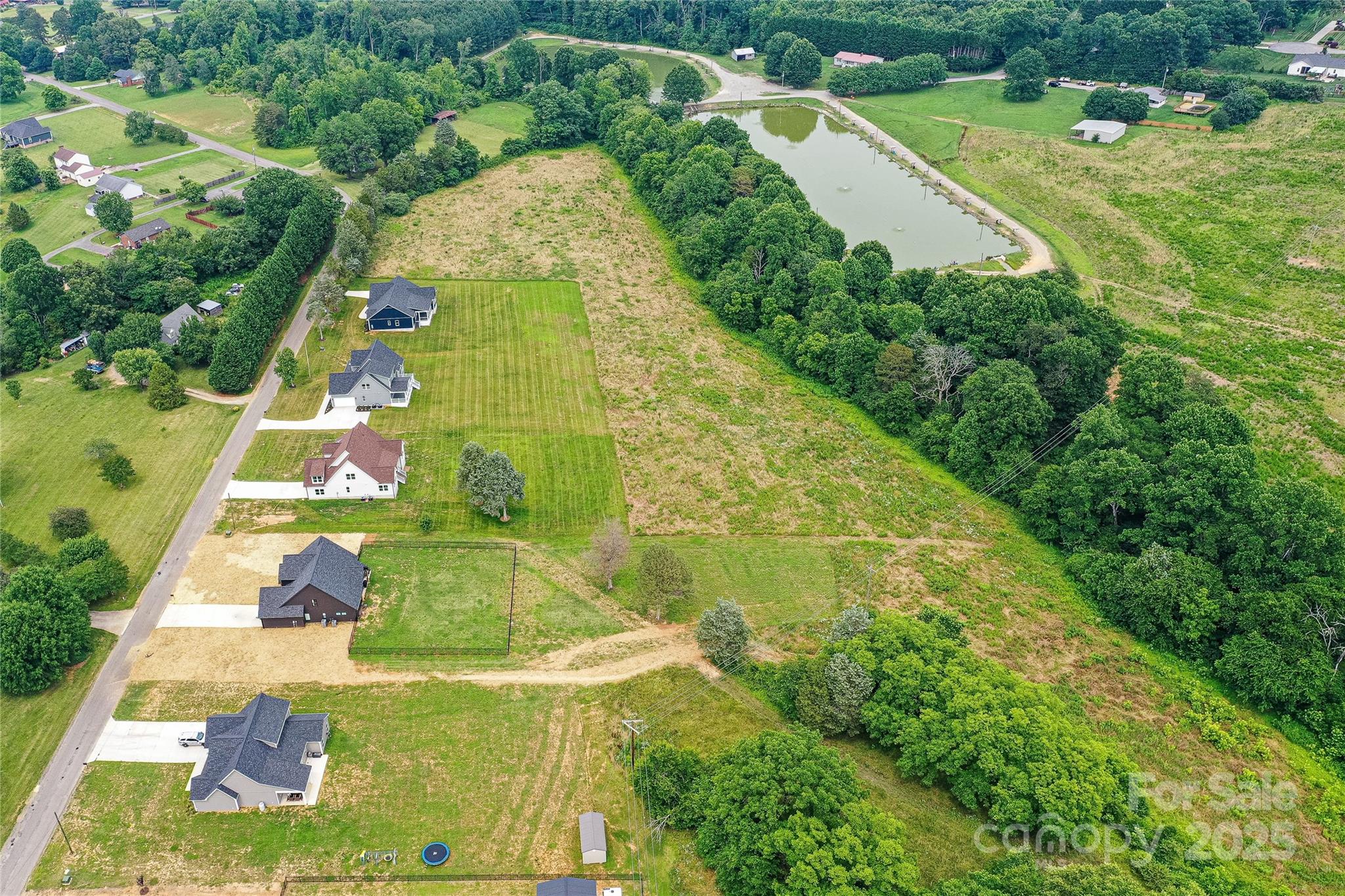 181 Lone Pine Road Statesville, NC 28625 - Photo 42 of 42 an aerial view of residential houses with outdoor space