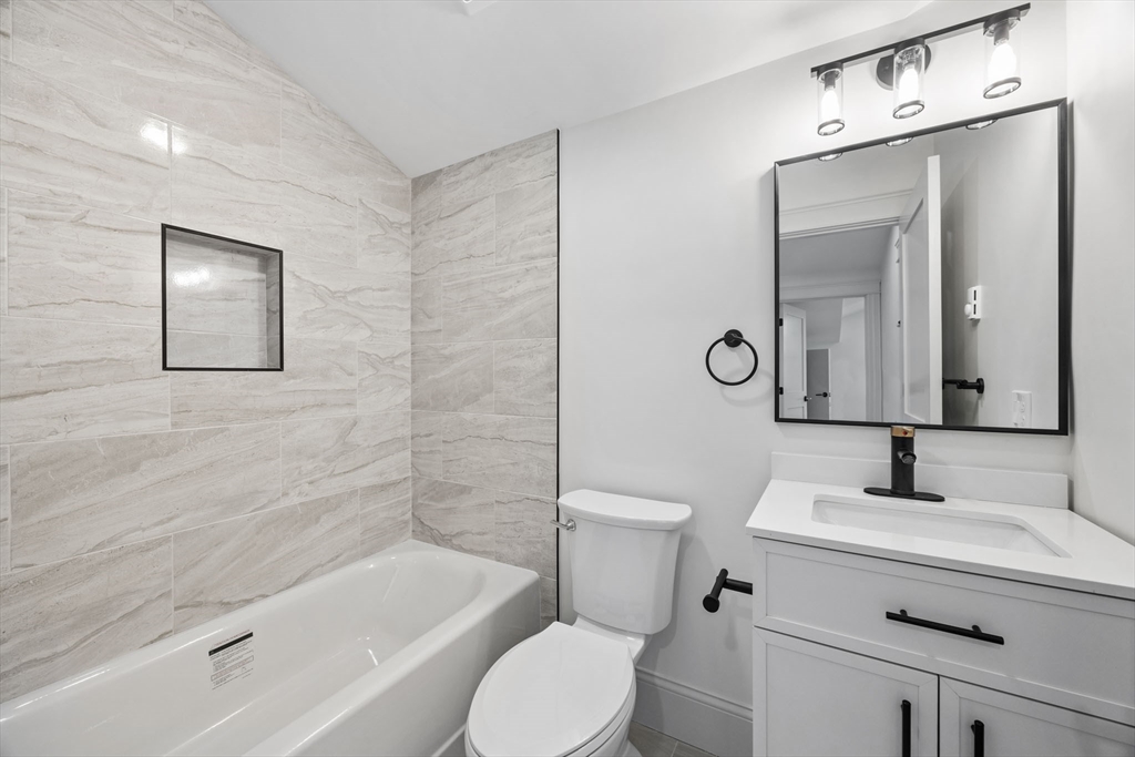 9 Swan Street, Unit 3 Beverly, MA 01915 - Photo 15 of 36 a bathroom with a sink toilet and shower