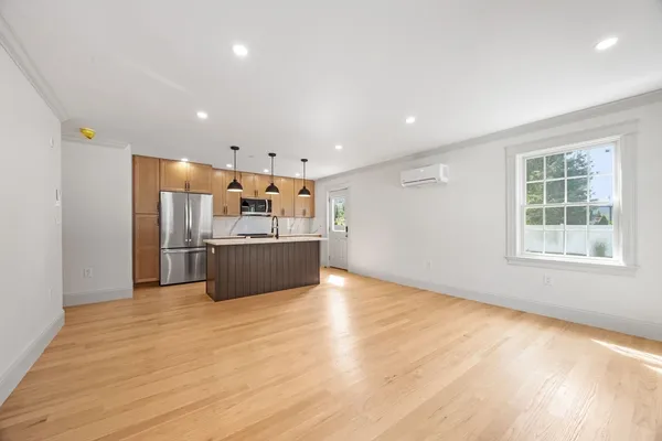 a kitchen with stainless steel appliances a refrigerator and a sink