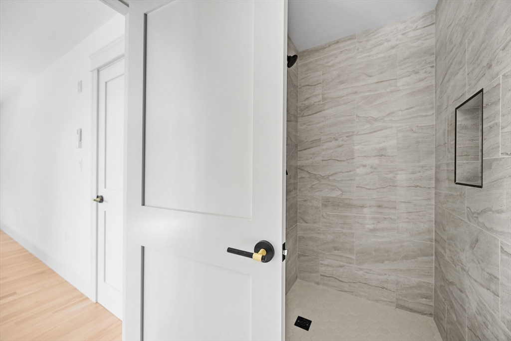 9 Swan Street, Unit 3 Beverly, MA 01915 - Photo 23 of 36 a bathroom with a shower