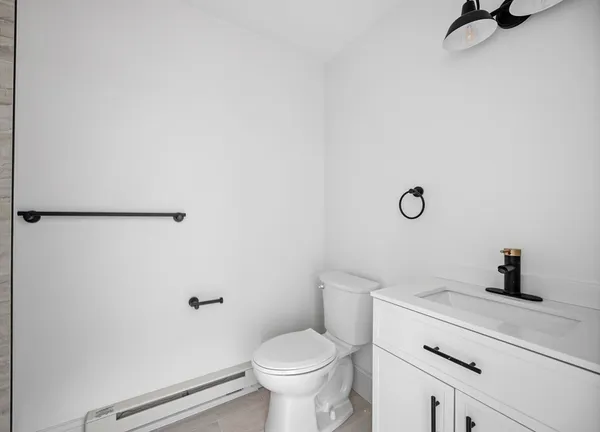 a bathroom with a toilet and a sink