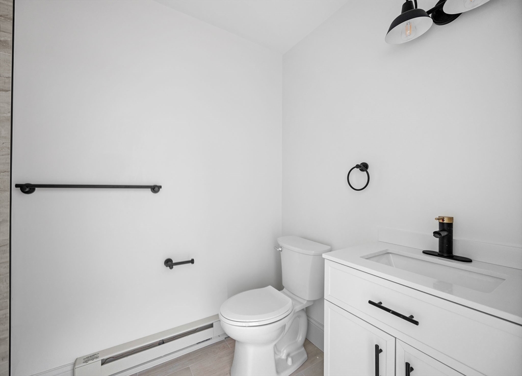 9 Swan Street, Unit 3 Beverly, MA 01915 - Photo 24 of 36 a bathroom with a toilet and a sink