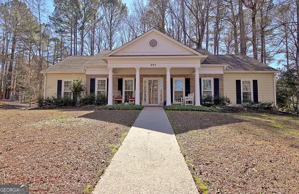 front view of a house with a yard