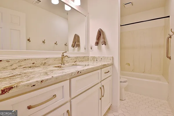 a bathroom with a sink and a shower