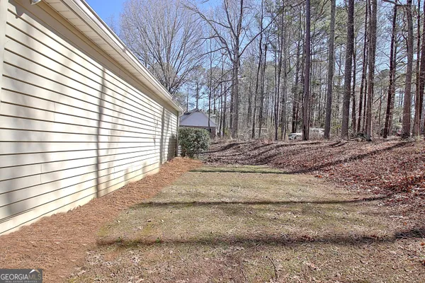 a view of a backyard of the house