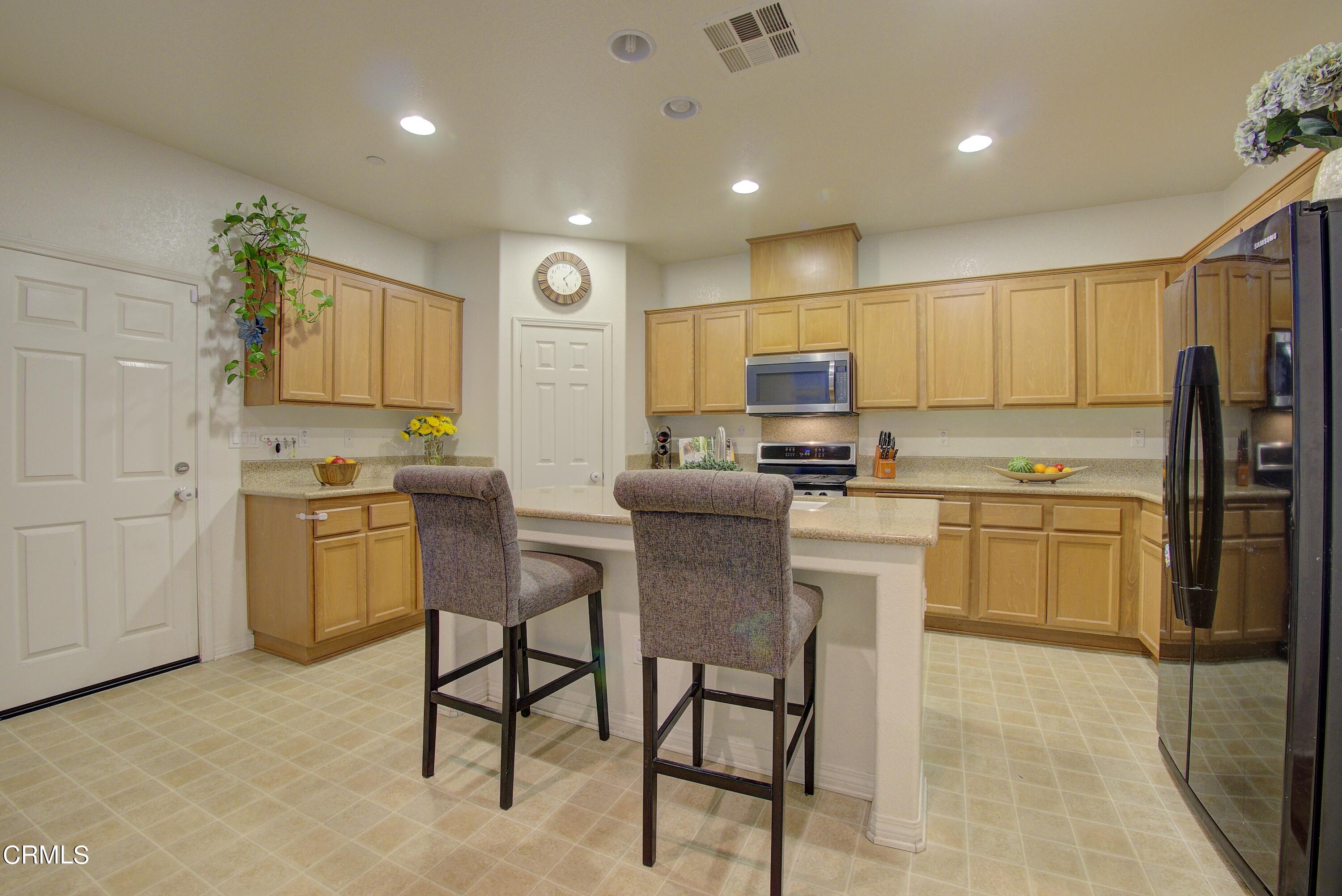 3145 North Ventura Road Oxnard, CA 93036 - Photo 54 of 75 a kitchen with a sink cabinets and stainless steel appliances