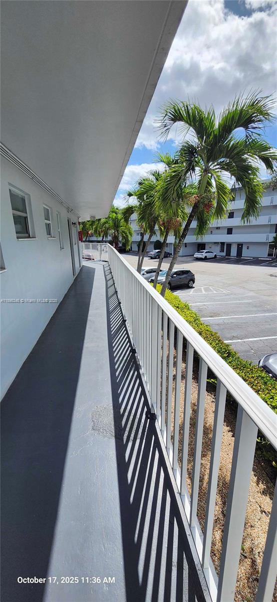 443 Northeast 195th Street, Unit 238 Miami, FL 33179 - Photo 14 of 15 a view of balcony with wooden floor