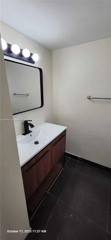 a bathroom with a toilet and a window