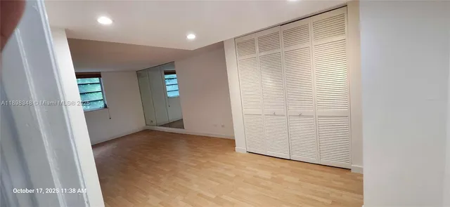 a view of a bathroom with wooden floor