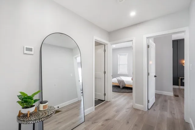 a bedroom with furniture and a potted plant