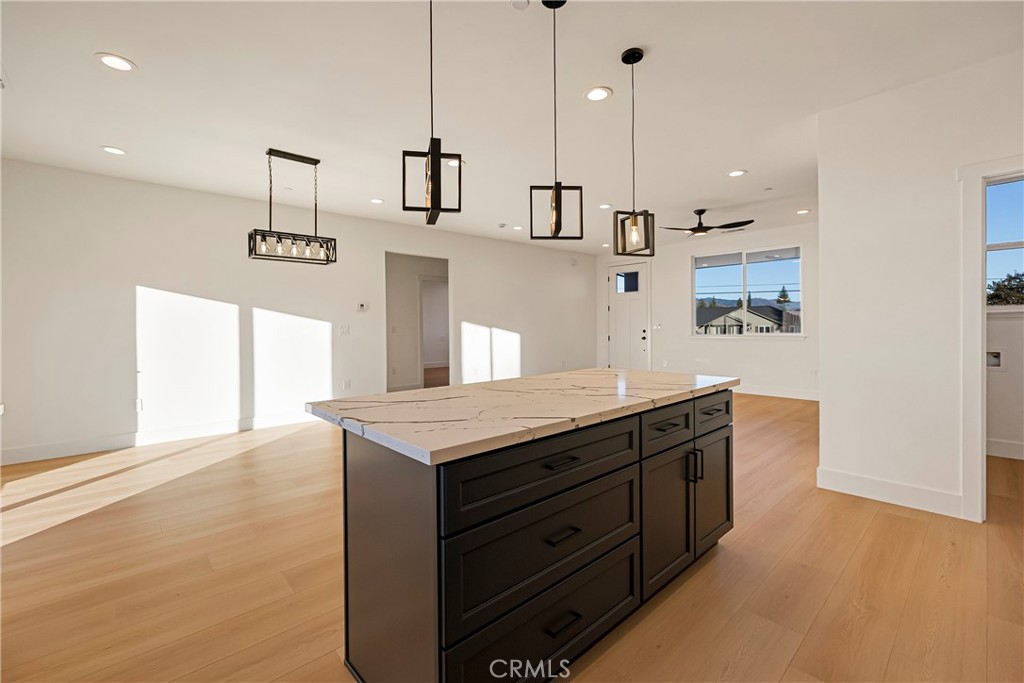 5369 Pentz Road Paradise, CA 95969 - Photo 22 of 42 a kitchen with granite countertop a stove a sink and a refrigerator