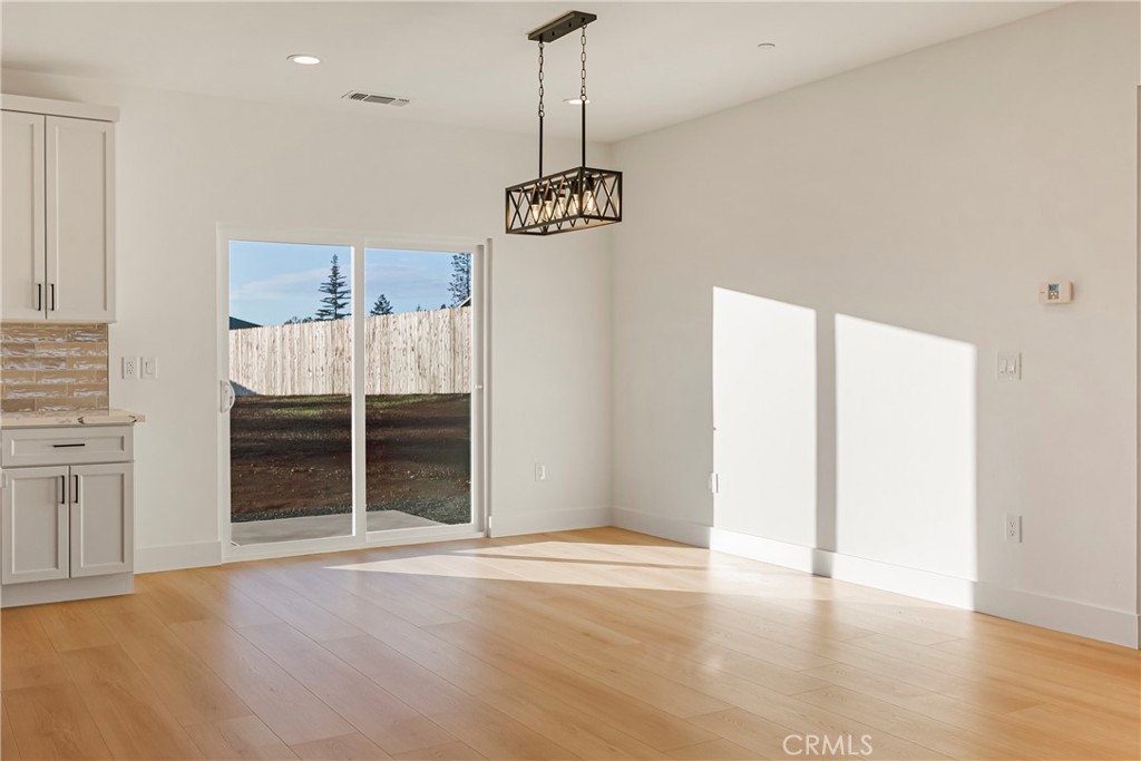 5369 Pentz Road Paradise, CA 95969 - Photo 23 of 42 a view of a room with wooden floor and window