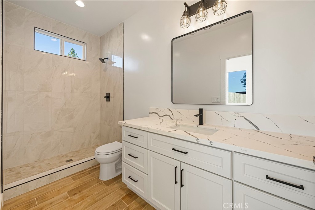 5369 Pentz Road Paradise, CA 95969 - Photo 29 of 42 a bathroom with a granite countertop sink toilet and shower