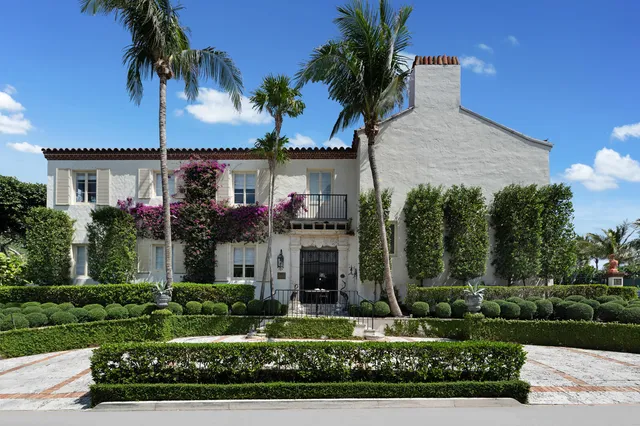 front view of a house with a garden