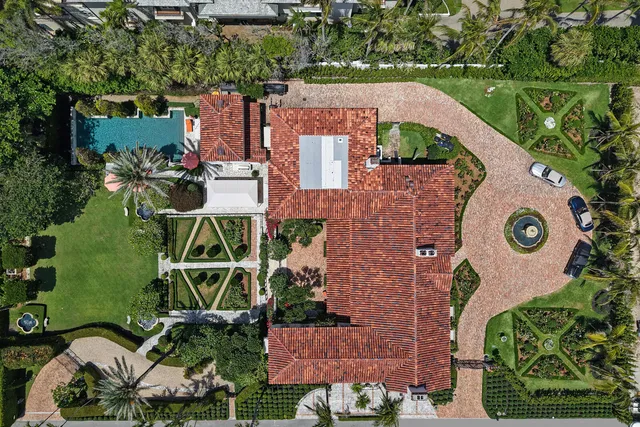an aerial view of a house with outdoor space swimming pool and tennis court