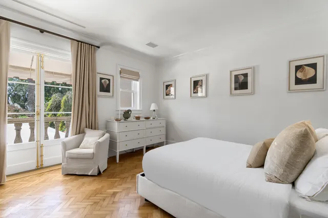 a view of a patio with table and chairs and potted plants