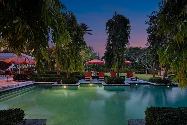 a view of swimming pool with outdoor seating