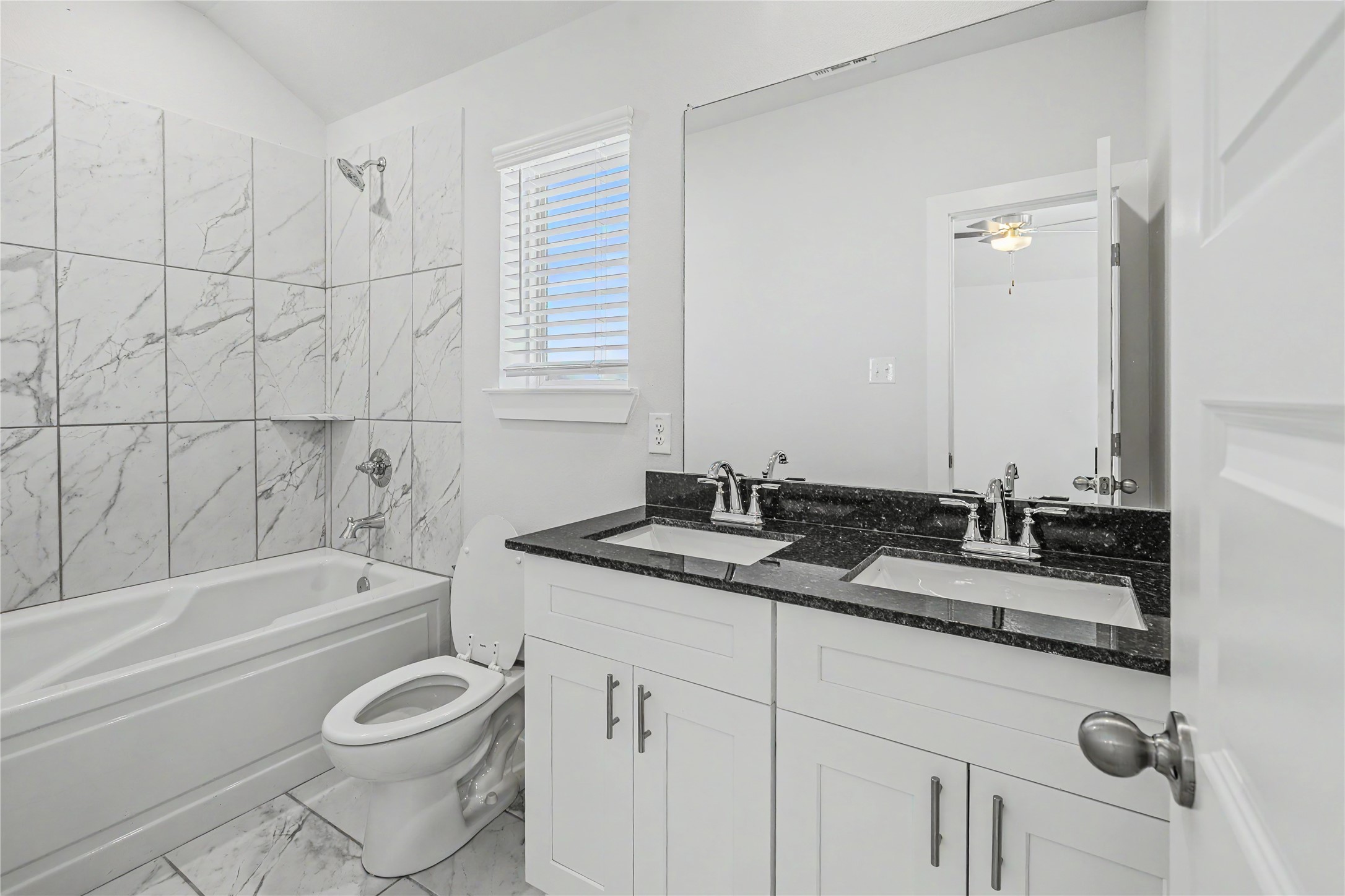 6426 Bolinas Court Rosharon, TX 77583 - Photo 33 of 49 a bathroom with a granite countertop sink a toilet and bathtub