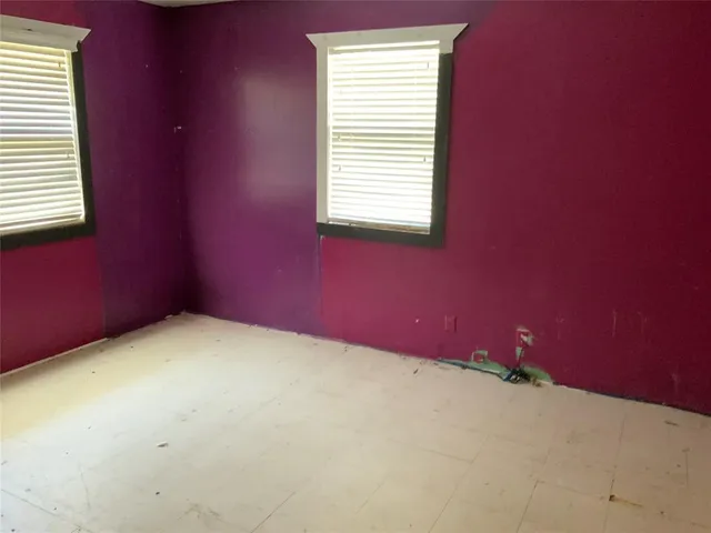 an empty room with a empty space and a window