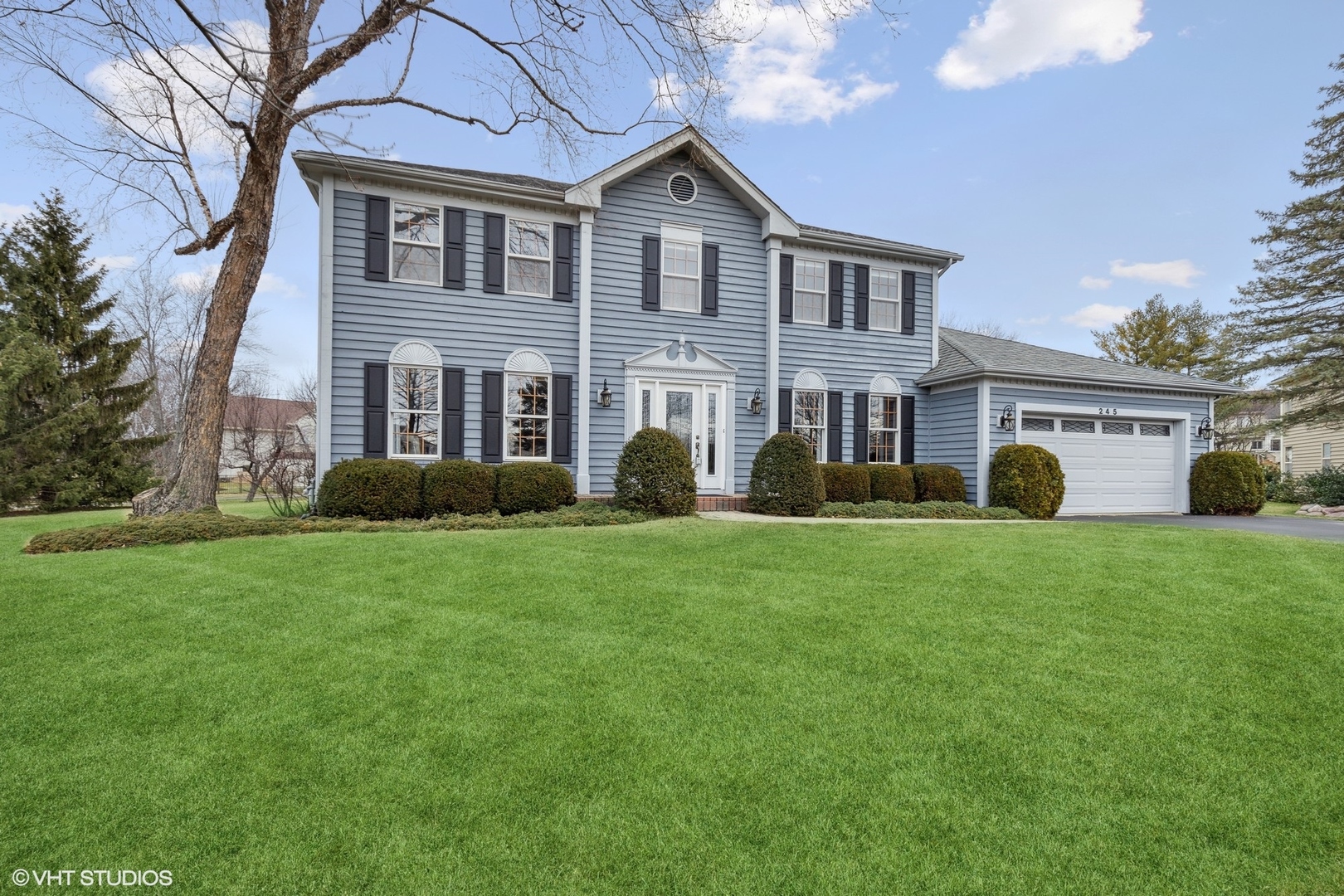 245 Big Terra Lane Gurnee, IL 60031 - Photo 1 of 25 a front view of house with yard and green space