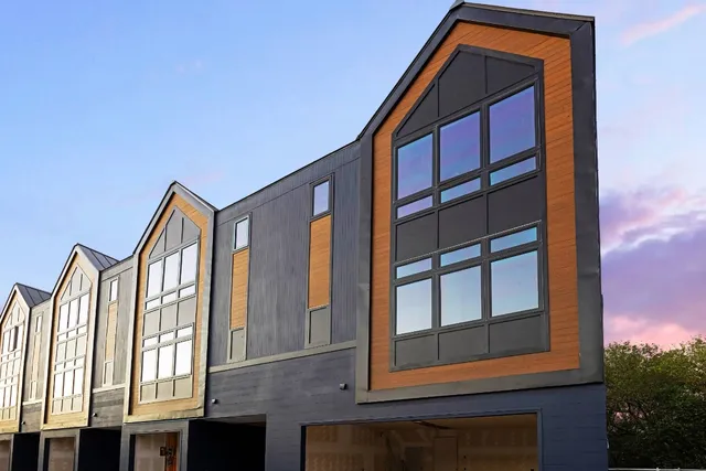 a front view of a house with a small yard