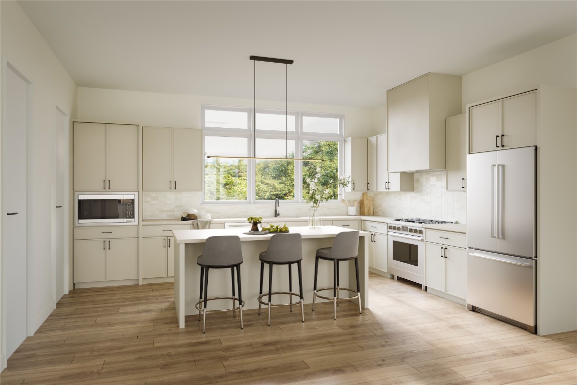 4101 Menchaca Road, Unit 103 Austin, TX 78704 - Photo 2 of 6 a kitchen with a refrigerator and a stove top oven