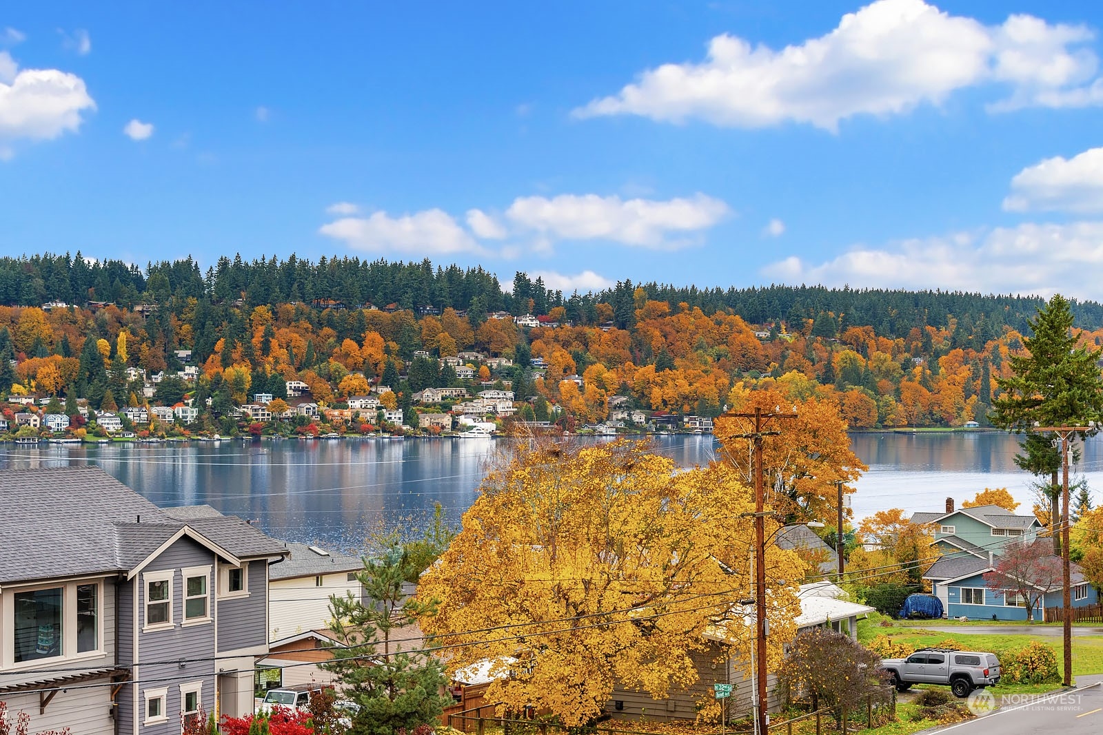 910 North 31st Street Renton, WA 98056 - Photo 12 of 32 a view of a lake with boats and trees in the background
