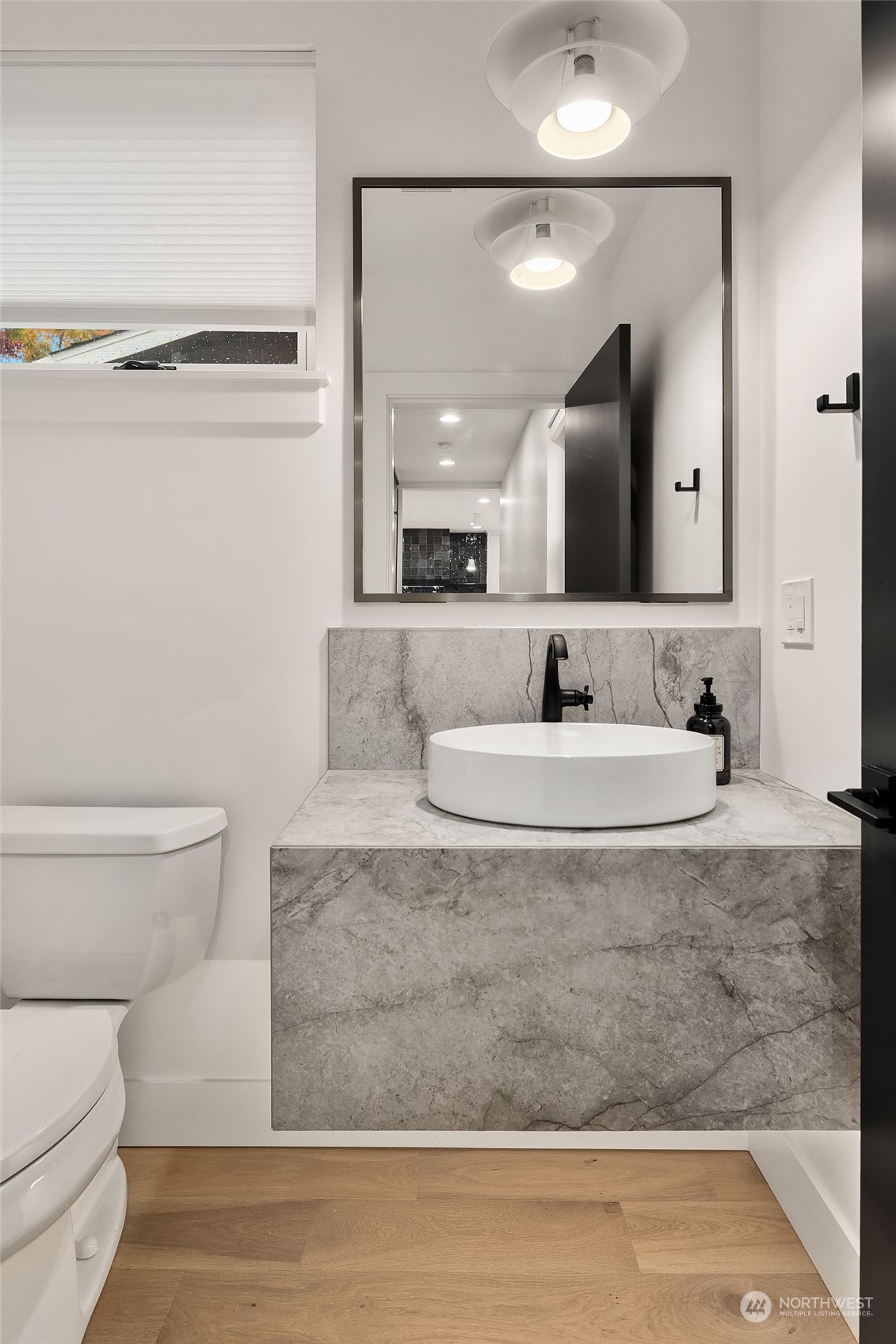 910 North 31st Street Renton, WA 98056 - Photo 16 of 32 a bathroom with a granite countertop sink and a mirror