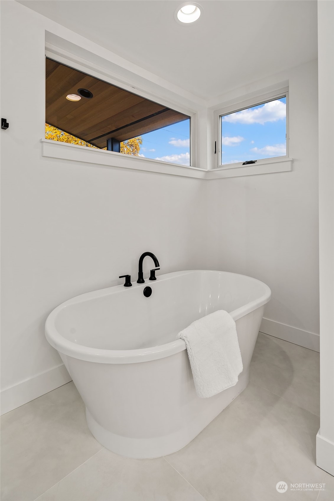 910 North 31st Street Renton, WA 98056 - Photo 22 of 32 a white bath tub sitting in a bathroom