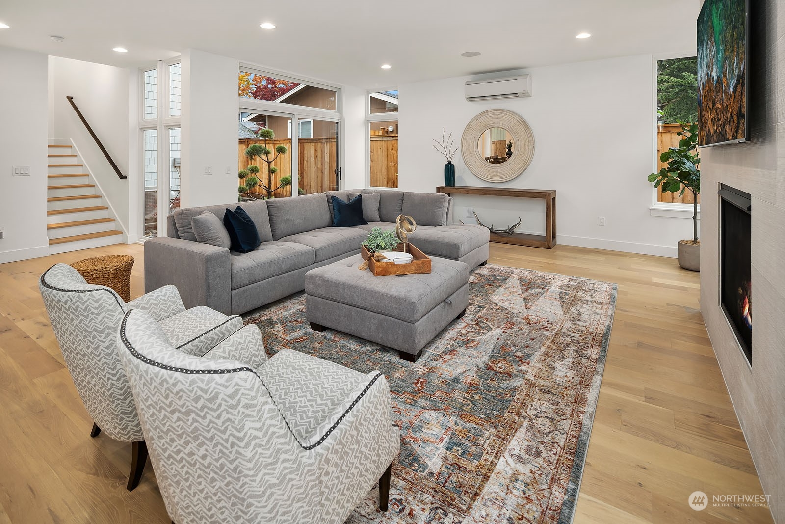 910 North 31st Street Renton, WA 98056 - Photo 6 of 32 a living room with furniture and a flat screen tv