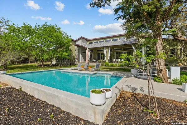 a view of a swimming pool with a patio