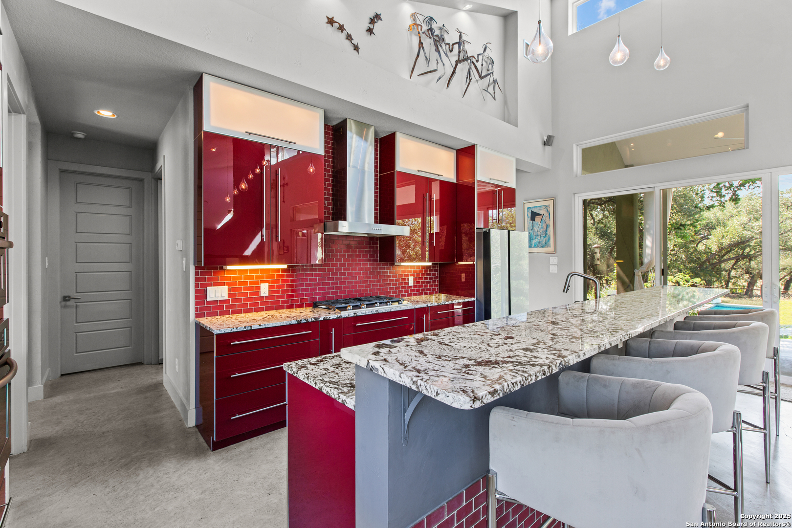 1280 Stoney Ridge Road Bulverde, TX 78163 - Photo 18 of 25 a kitchen with a stove a sink and a refrigerator