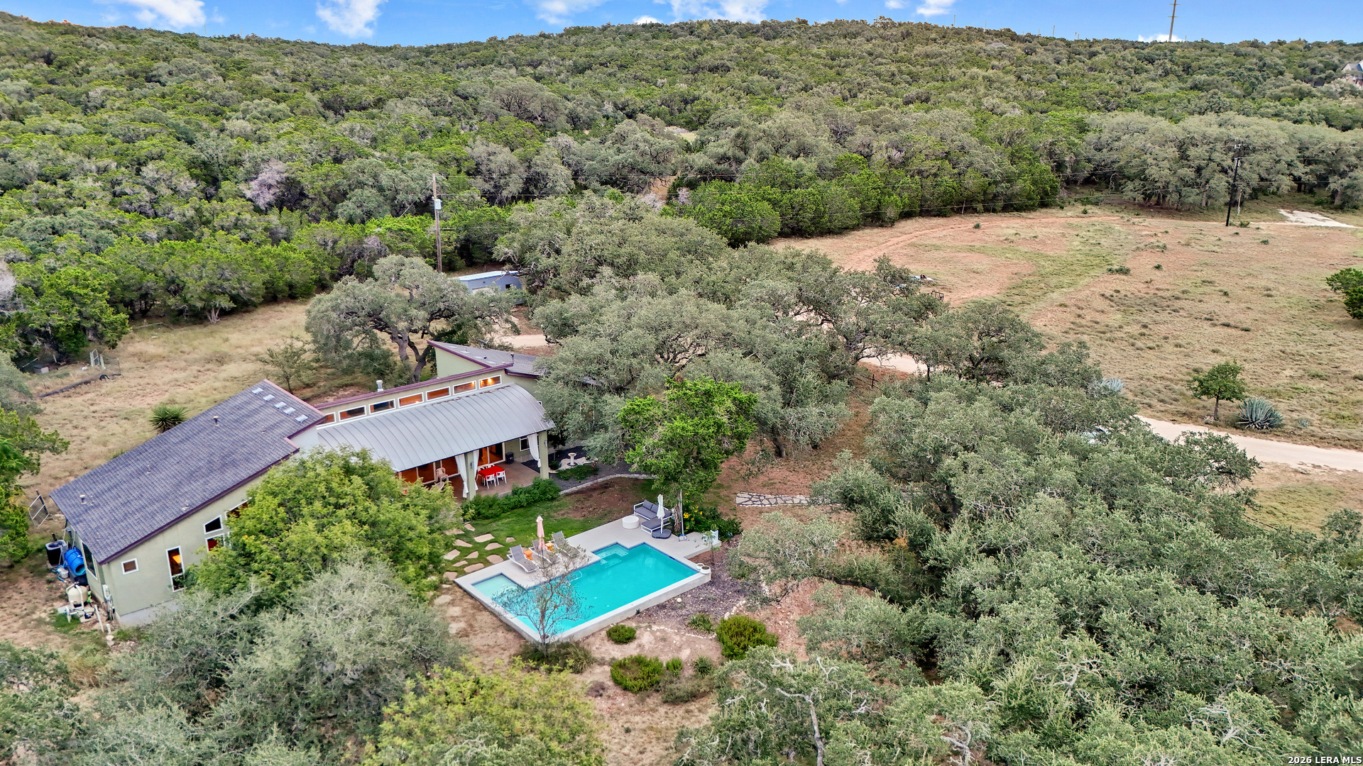 1280 Stoney Ridge Road Bulverde, TX 78163 - Photo 2 of 43 an aerial view of a house with a yard